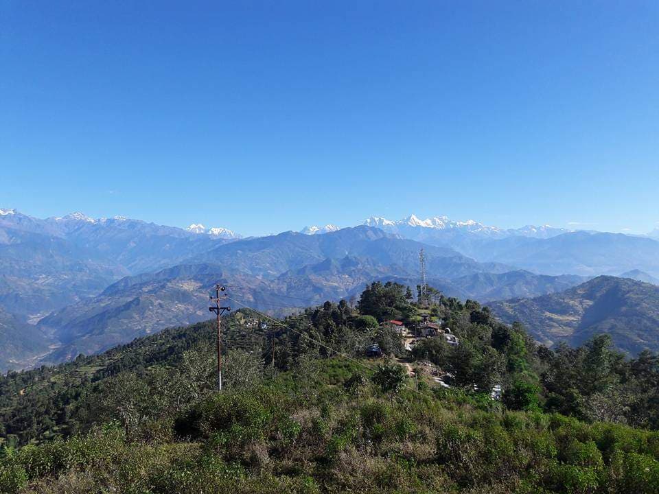 Hillside farmland with Himalayan backdrop